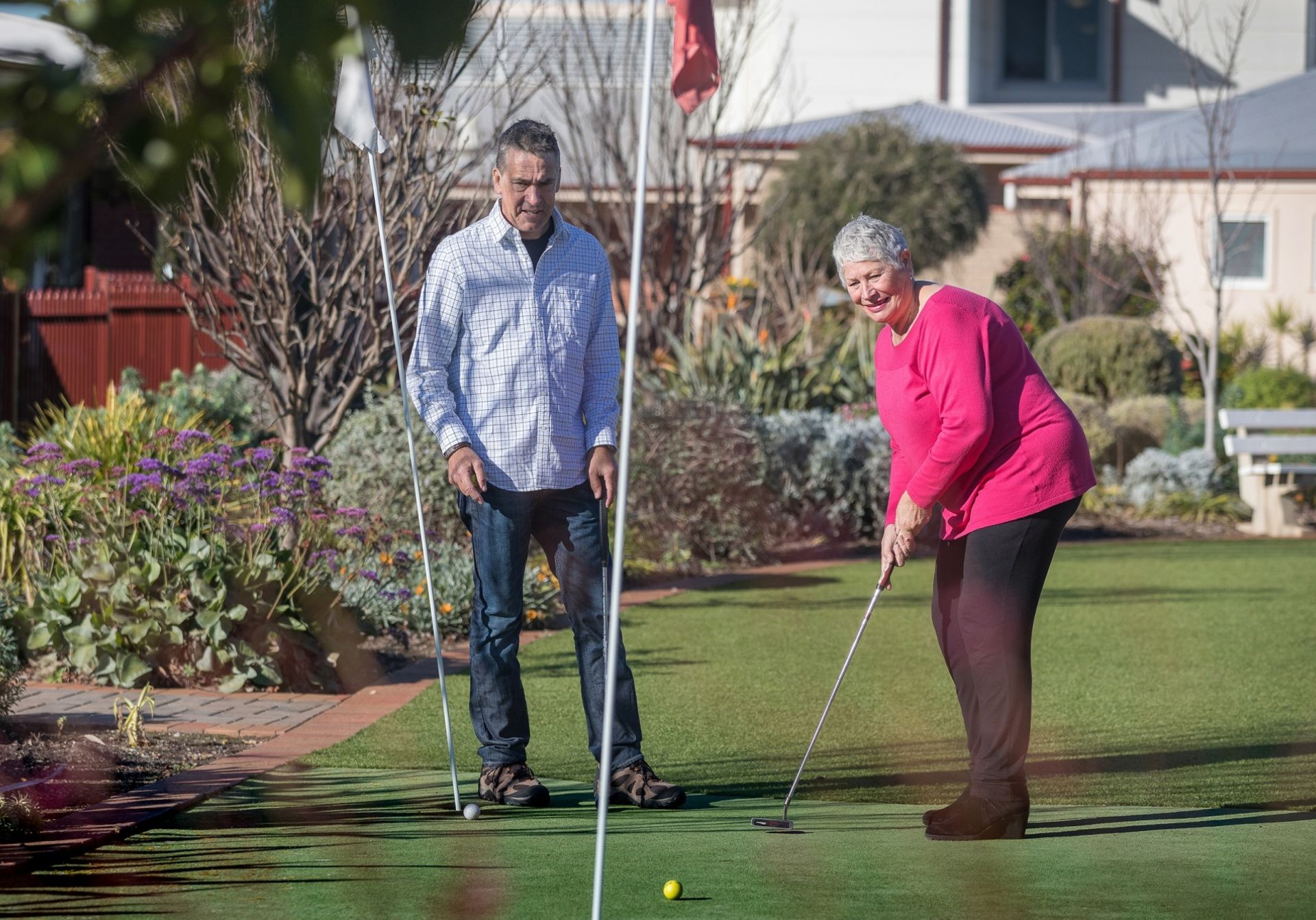 couple playing golf