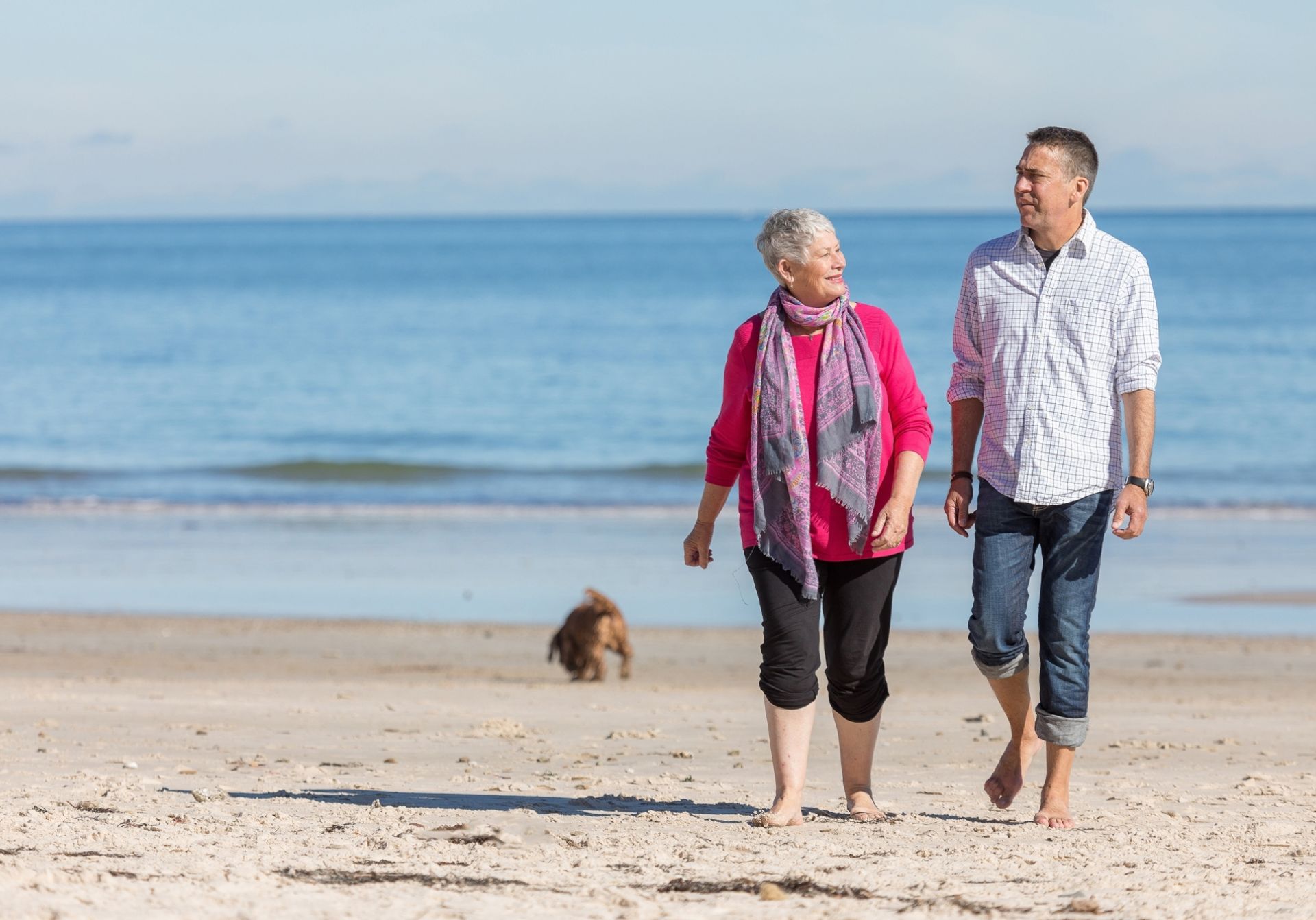 women and man with dog